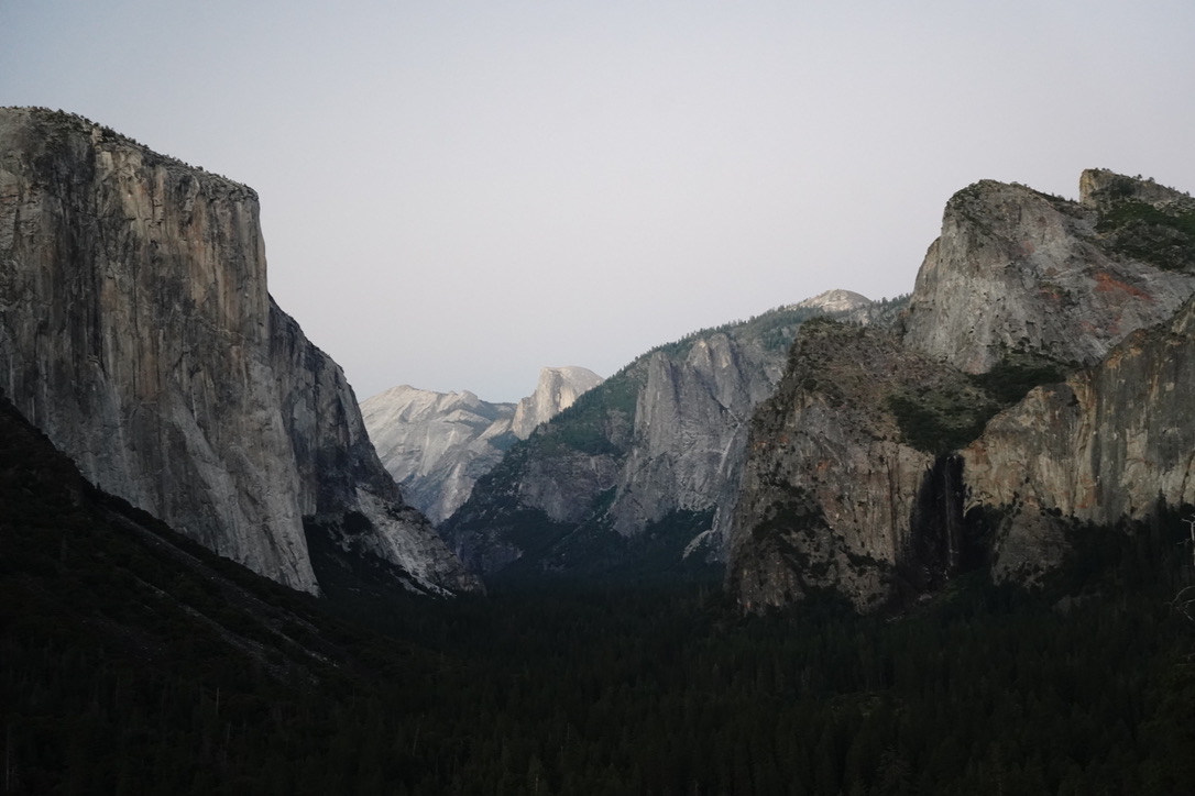 Yosemite valley at dusk, El Capitan on the left and Half Dome in the distance